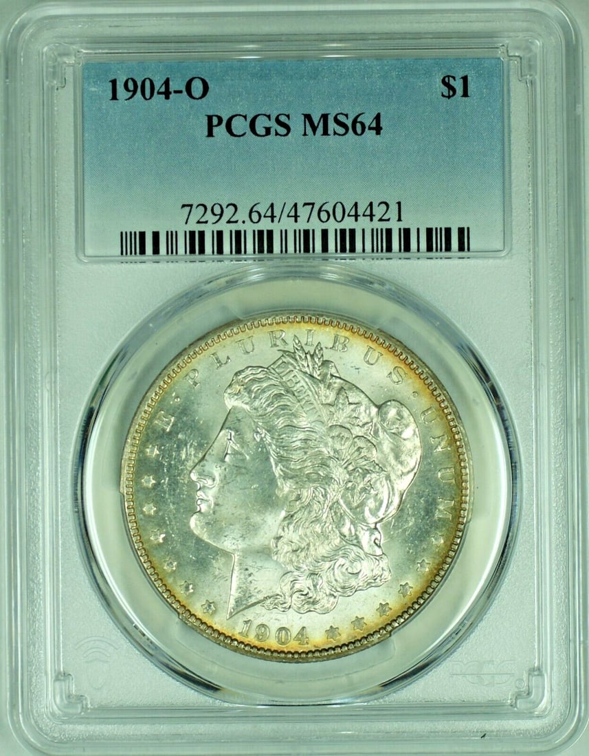 Toned Reverse 1904-O Morgan Silver Dollar PCGS MS 64 Uncirculated $1 Coin: Toned Reverse 1904-O Morgan Silver Dollar PCGS MS 64 Uncirculated $1 Coin This 1904-O Morgan Silver Dollar is a $1 coin from the United States. It is composed of silver and features attractive toning 