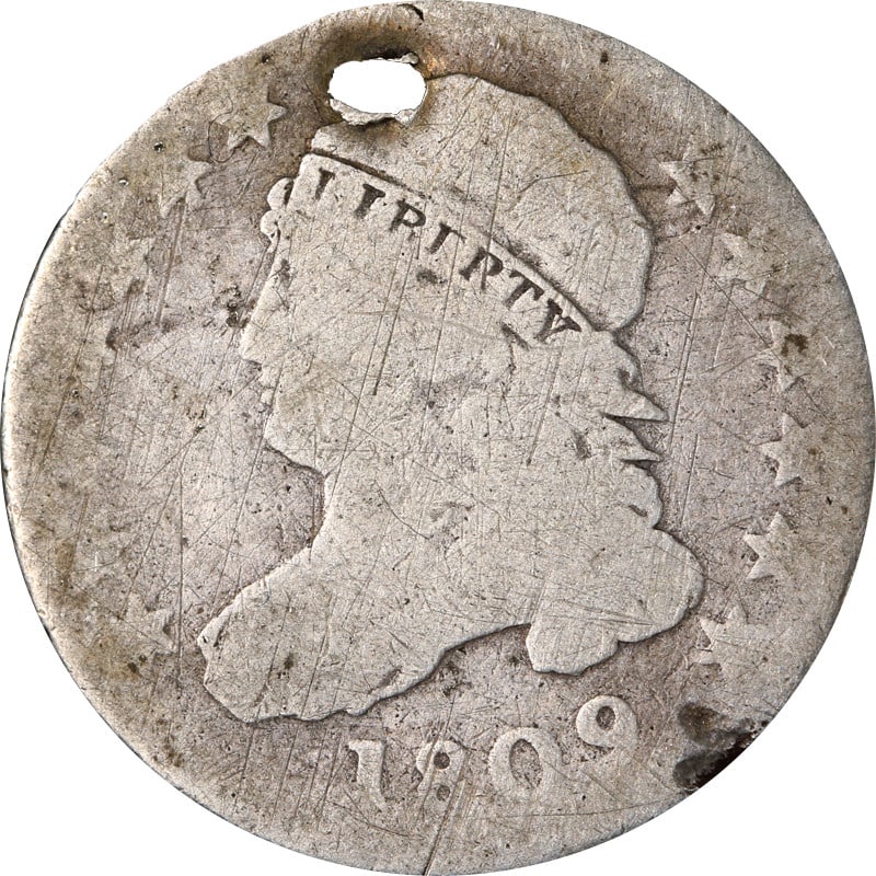 Holed 1809 Silver Dime Draped Bust Circulated Example: Holed 1809 Silver Dime Draped Bust Circulated Example This 1809 Bust Dime is a circulated silver coin featuring a holed design. With a silver fineness of 0.9, it offers a glimpse into early 19th-centu