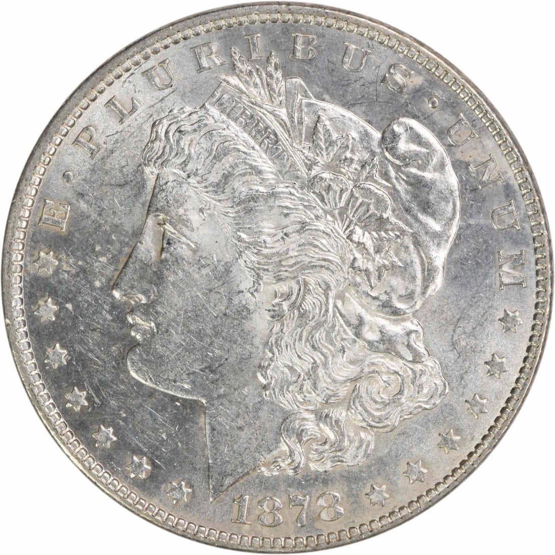 1878 Morgan Silver Dollar AU Slider 90% Silver Uncertified: 1878 Morgan Silver Dollar AU Slider 90% Silver Uncertified This 1878 Morgan Silver Dollar is a remarkable piece of numismatic history, featuring the iconic design by George T. Morgan. The coin is clas