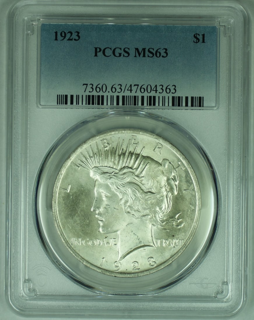 1923 Peace Dollar Silver Coin Graded MS 63 Plus by PCGS: 1923 Peace Dollar Silver Coin Graded MS 63 Plus by PCGS 1923 Peace Silver Dollar $1 coin, graded MS 63+ by PCGS. This uncirculated coin is composed of silver and features the iconic Peace design. Cert