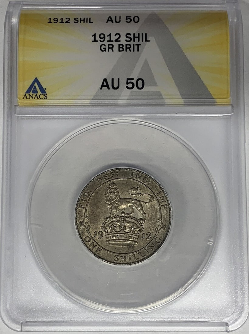 1912 United Kingdom Shilling Coin Graded AU 50 by ANACS: 1912 United Kingdom Shilling Coin Graded AU 50 by ANACS This is a 1912 Great Britain shilling coin, certified by ANACS with a grade of AU 50. The coin originates from the United Kingdom and is in pre-