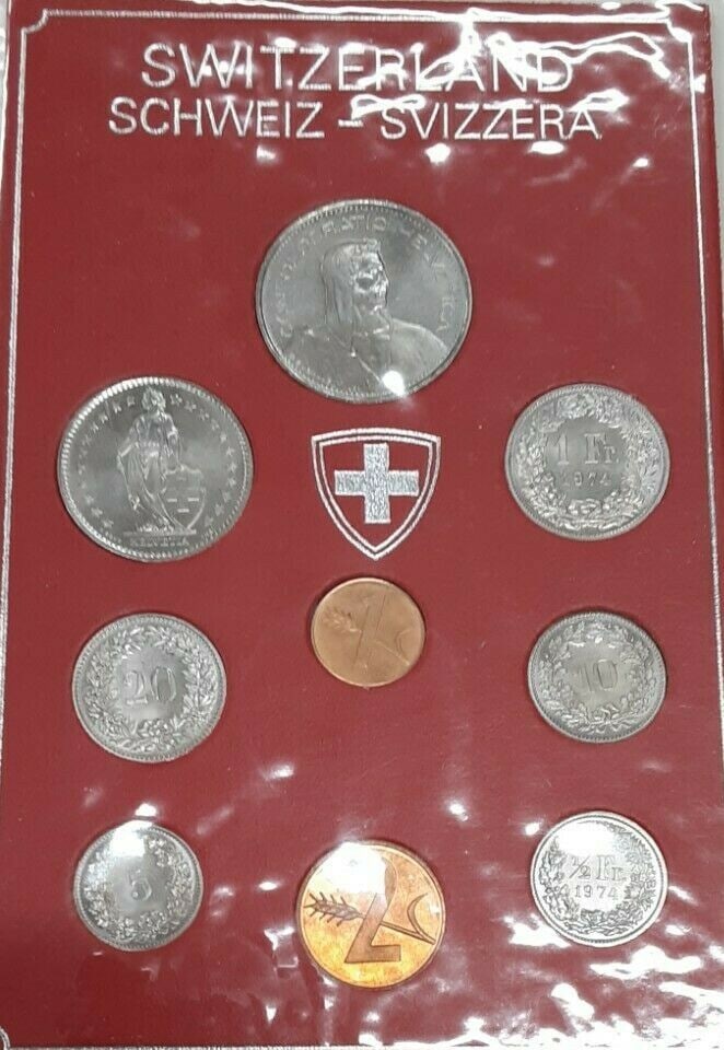 Nine Coin 1974 Swiss Mint Brilliant Uncirculated Set in Original Holder: Nine Coin 1974 Swiss Mint Brilliant Uncirculated Set in Original Holder This 1974 Switzerland Mint Set includes nine brilliant uncirculated coins presented in a holder. The set features denominations 