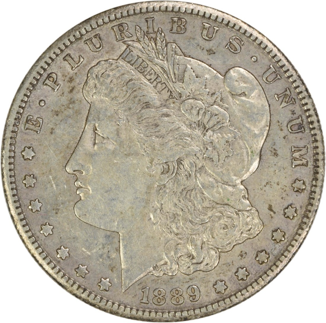 Silver $1 Morgan Coin 1889 San Francisco Mint AU Grade Uncertified: Silver $1 Morgan Coin 1889 San Francisco Mint AU Grade Uncertified This 1889-S Morgan Dollar is a circulated coin from the United States, minted in San Francisco. Composed of silver, it features the i