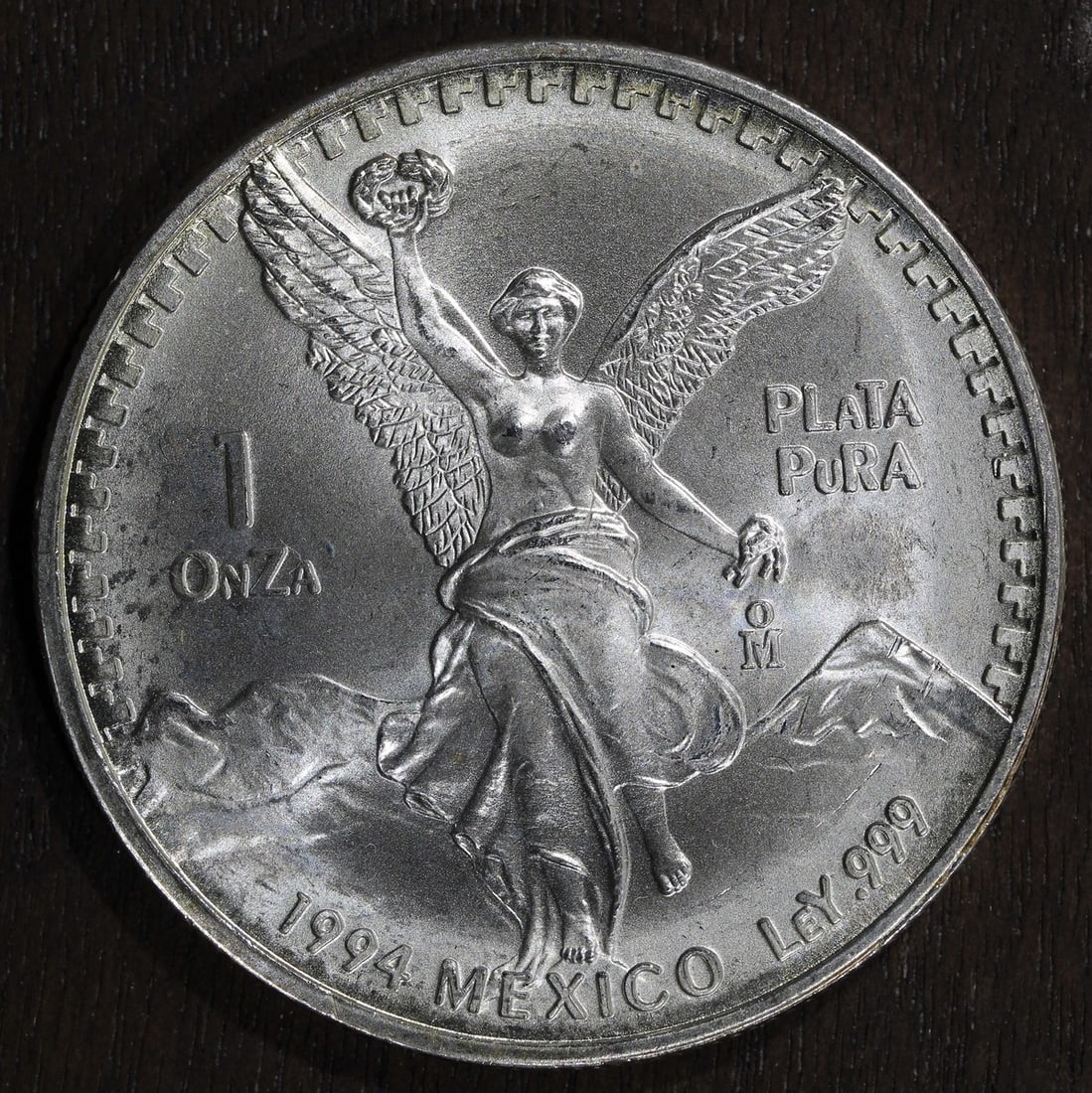 1994 Mexican Libertad 1 oz .999 Silver Coin BU: 1994 Mexican Libertad 1 oz .999 Silver Coin BU This 1994-Mo Mexico 1 oz Silver Libertad Onza coin features a composition of .999 fine silver and was produced by the Mexican Mint. The coin is ungraded,