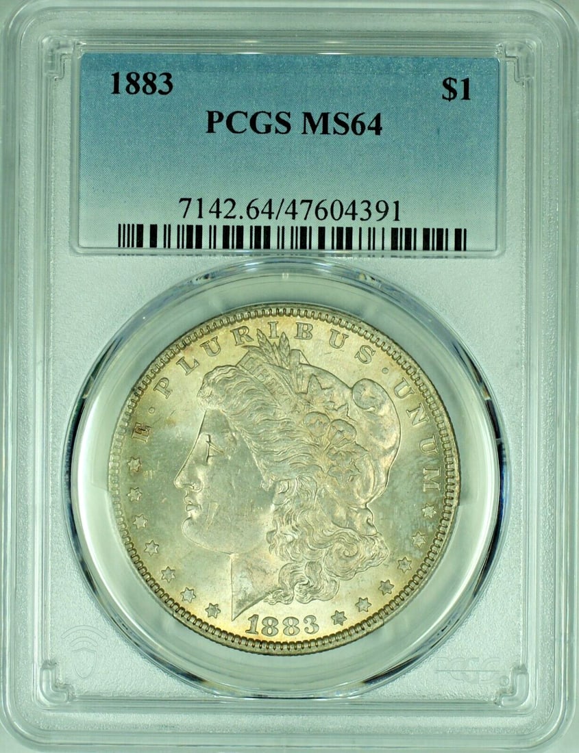 PCGS MS 64 1883 Morgan Silver Dollar with Toning: PCGS MS 64 1883 Morgan Silver Dollar with Toning This 1883 Morgan Silver Dollar is certified by PCGS with a grade of MS 64. It is an uncirculated coin featuring attractive toning. The coin is composed