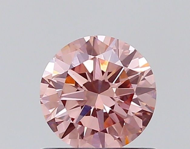 Loose Diamond - ROUND 0.65ct Fancy Vivid Pink VS1: Loose Diamond - ROUND 0.65ct Fancy Vivid Pink VS1 Source: This is a real non-mined Diamond that has been grown in a lab Shape: ROUND Carats: 0.65 Color: Fancy Vivid Pink Certification: NONE Additional