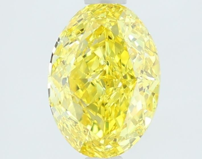 Loose Diamond - OVAL 1.52ct Fancy Vivid Yellow VVS2: Loose Diamond - OVAL 1.52ct Fancy Vivid Yellow VVS2 Source: This is a real non-mined Diamond that has been grown in a lab Shape: OVAL Carats: 1.52 Color: Fancy Vivid Yellow Certification: IGI Video: