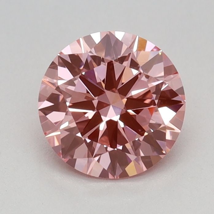 Loose Diamond - ROUND 0.67ct Fancy Vivid Pink VVS2: Loose Diamond - ROUND 0.67ct Fancy Vivid Pink VVS2 Source: This is a real non-mined Diamond that has been grown in a lab Shape: ROUND Carats: 0.67 Color: Fancy Vivid Pink Certification: IGI Video: