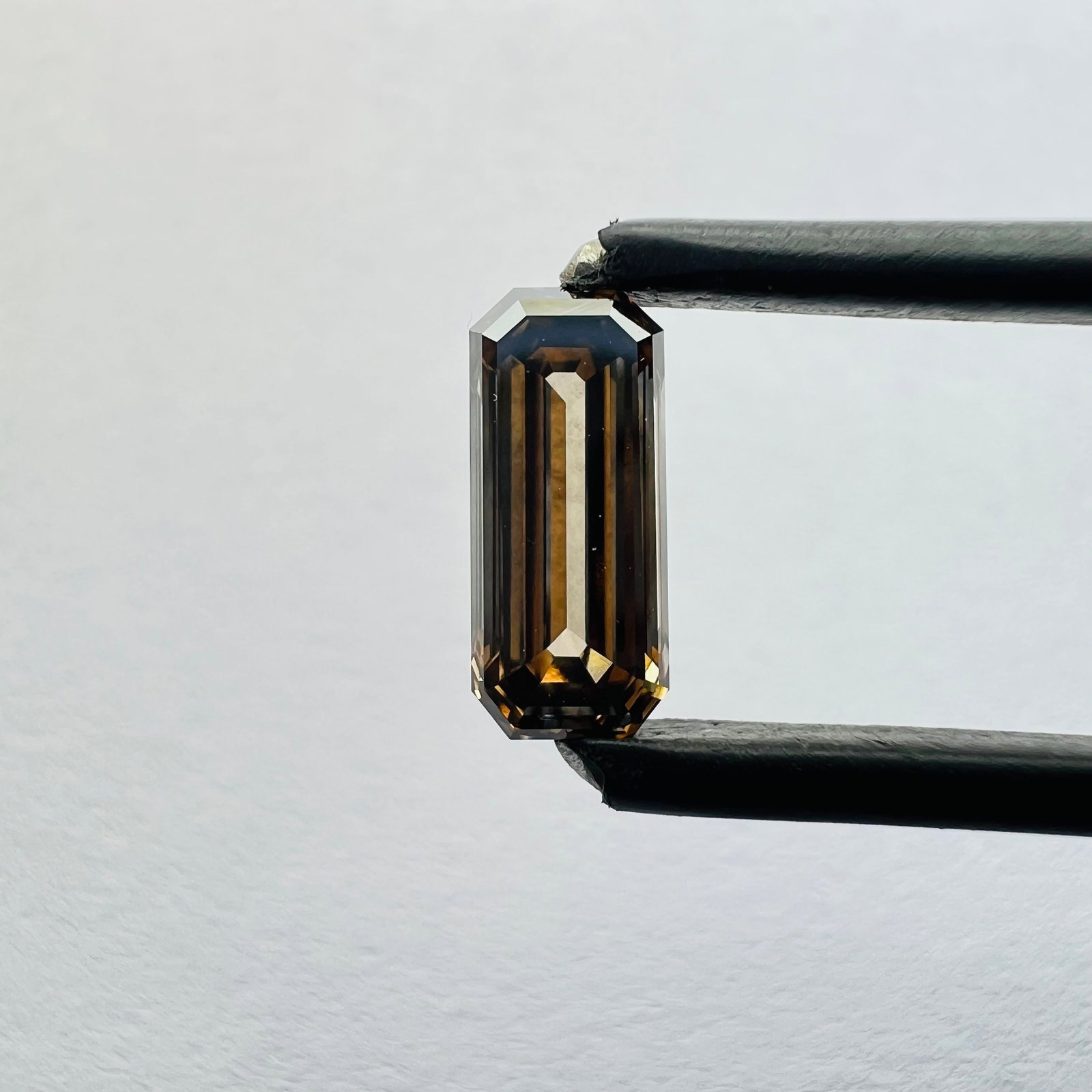 Loose Diamond - EMERALD 0.84ct Brown VVS2: Loose Diamond - EMERALD 0.84ct Brown VVS2 Source: This is a real non-mined Diamond that has been grown in a lab Shape: EMERALD Carats: 0.84 Color: Brown Certification: NONE Additional images available