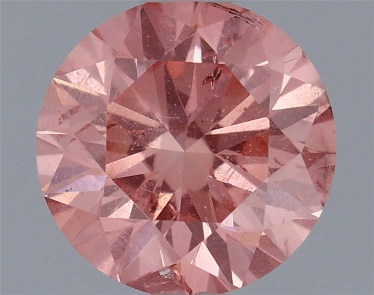Loose Diamond - ROUND 0.79ct Fancy Vivid Pink SI2: Loose Diamond - ROUND 0.79ct Fancy Vivid Pink SI2 Source: This is a real non-mined Diamond that has been grown in a lab Shape: ROUND Carats: 0.79 Color: Fancy Vivid Pink Certification: IGI Video: