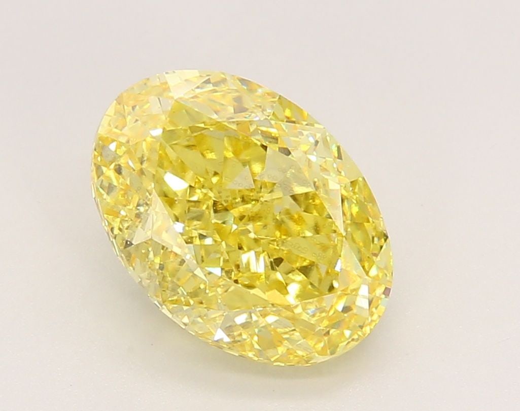 Loose Diamond - OVAL 3.3ct Fancy Vivid Yellow VS2: Loose Diamond - OVAL 3.3ct Fancy Vivid Yellow VS2 Source: This is a real non-mined Diamond that has been grown in a lab Shape: OVAL Carats: 3.3 Color: Fancy Vivid Yellow Certification: IGI Video:
