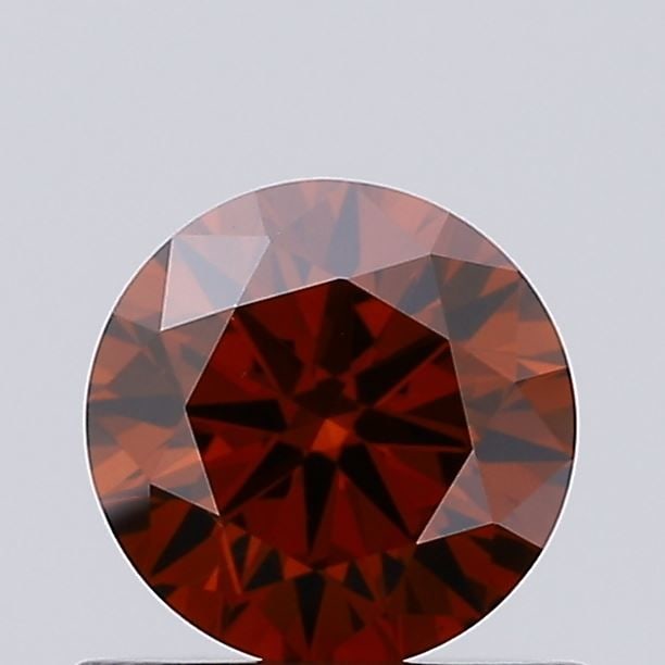 Loose Diamond - ROUND 0.54ct Fancy Deep Orange VS1: Loose Diamond - ROUND 0.54ct Fancy Deep Orange VS1 Source: This is a real non-mined Diamond that has been grown in a lab Shape: ROUND Carats: 0.54 Color: Fancy Deep Orange Certification: IGI Video: