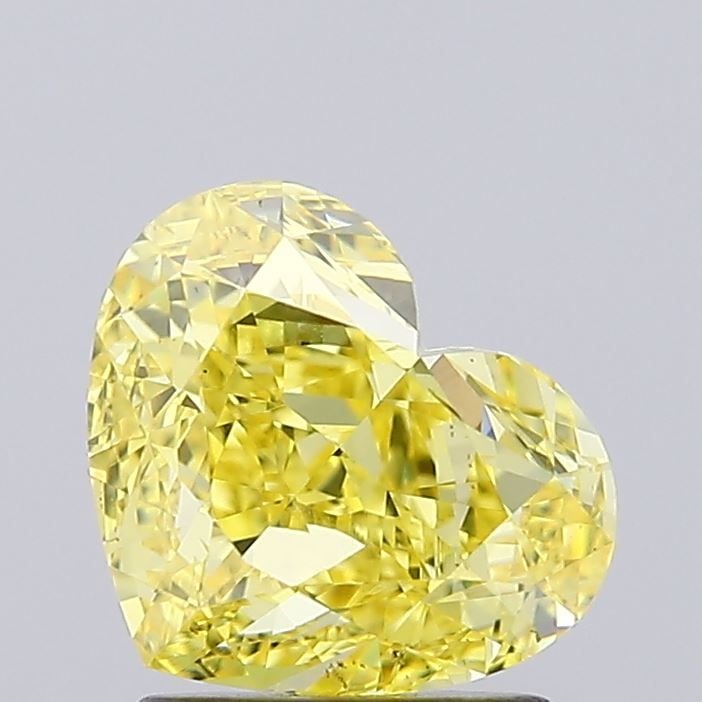 Loose Diamond - HEART 2.14ct Fancy Vivid Yellow VS1: Loose Diamond - HEART 2.14ct Fancy Vivid Yellow VS1 Source: This is a real non-mined Diamond that has been grown in a lab Shape: HEART Carats: 2.14 Color: Fancy Vivid Yellow Certification: IGI Video: