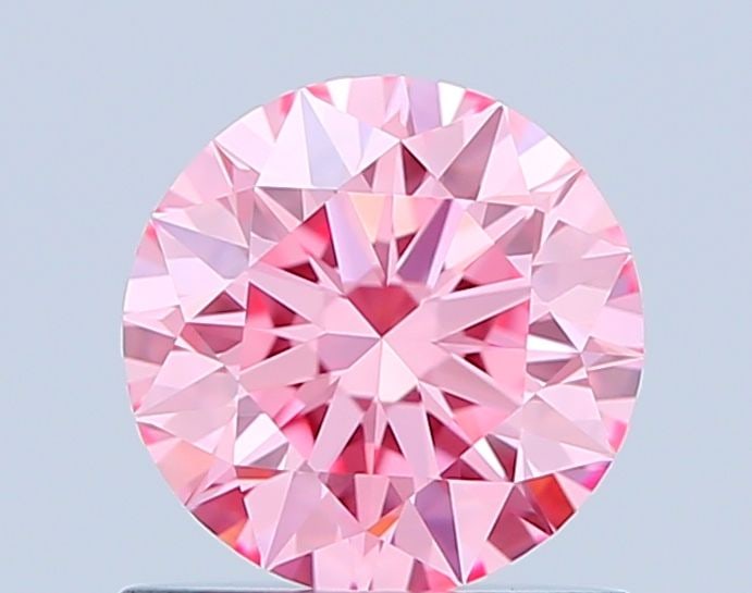 Ideal Loose Diamond - ROUND 0.8ct Fancy Vivid Pink VVS2: Ideal Loose Diamond - ROUND 0.8ct Fancy Vivid Pink VVS2 Source: This is a real non-mined Diamond that has been grown in a lab Shape: ROUND Carats: 0.8 Color: Fancy Vivid Pink Certification: IGI Video: