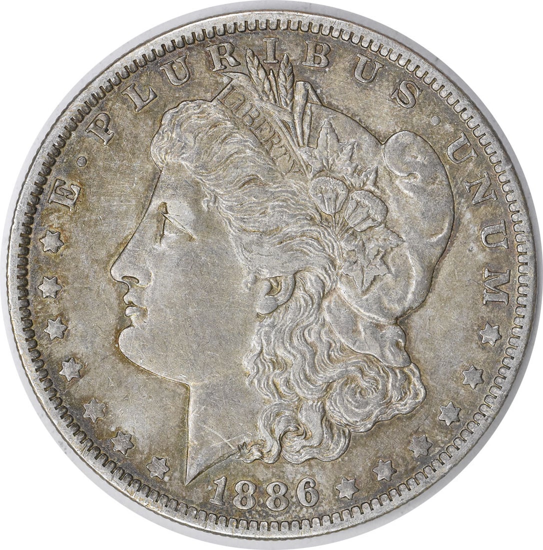 1886-O Morgan Silver Dollar 90% Silver Uncertified Coin: 1886-O Morgan Silver Dollar 90% Silver Uncertified Coin This 1886-O Morgan Silver Dollar is a beautiful example of American coinage, featuring a design by George T. Morgan. Struck in 90% silver and 10