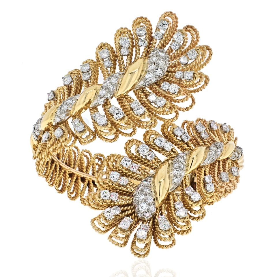 David Webb 18K Yellow Gold Crossover Diamond Bracelet 10 Cts: David Webb 18K Yellow Gold Crossover Diamond Bracelet 10 Cts This exquisite vintage David Webb cuff bracelet showcases a stunning crossover design crafted from luxurious 18K yellow gold and platinum. 