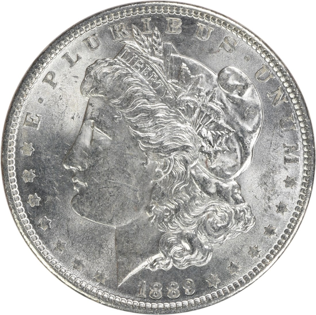 Brilliant Uncirculated 1889 Morgan Silver Dollar Uncertified No Mint Mark: Brilliant Uncirculated 1889 Morgan Silver Dollar Uncertified No Mint Mark This 1889 Morgan Silver Dollar is an uncirculated coin, featuring brilliant uncirculated (BU) grade. Composed of silver, this 