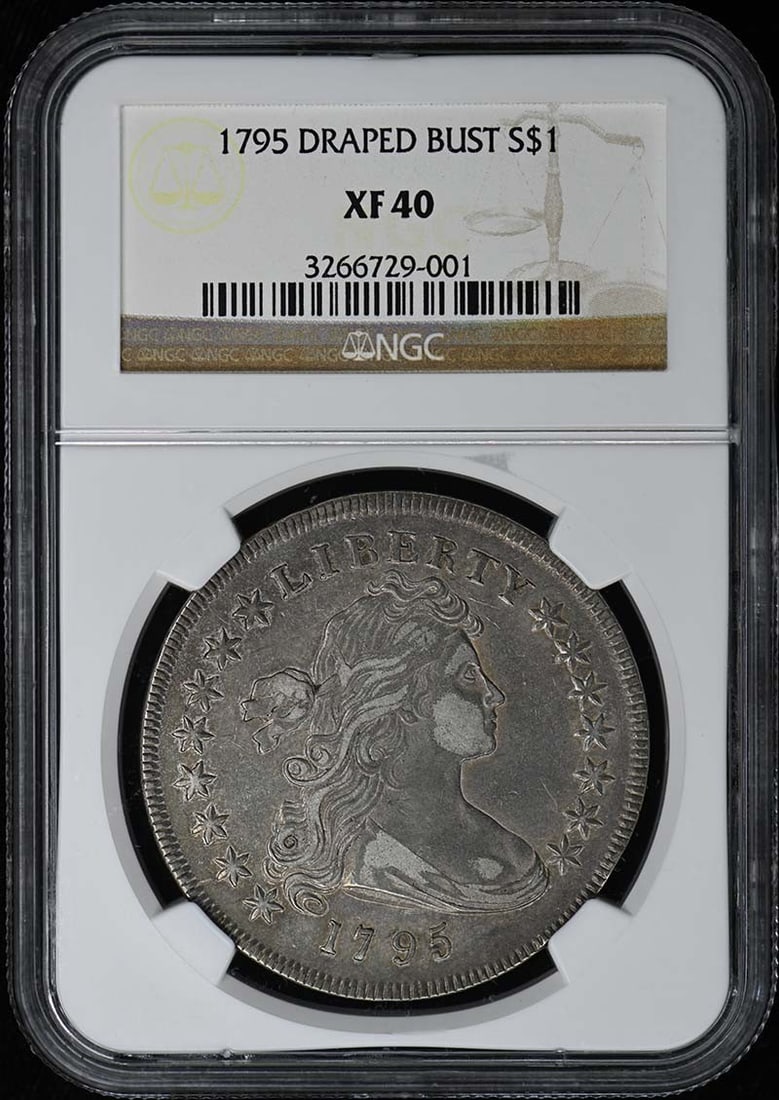 1795 Draped Bust Small Eagle Silver Dollar NGC XF40: 1795 Draped Bust Small Eagle Silver Dollar NGC XF40 This 1795 Draped Bust Small Eagle silver dollar is graded XF40 by NGC and originates from the Philadelphia Mint. It is a circulated coin from the Un