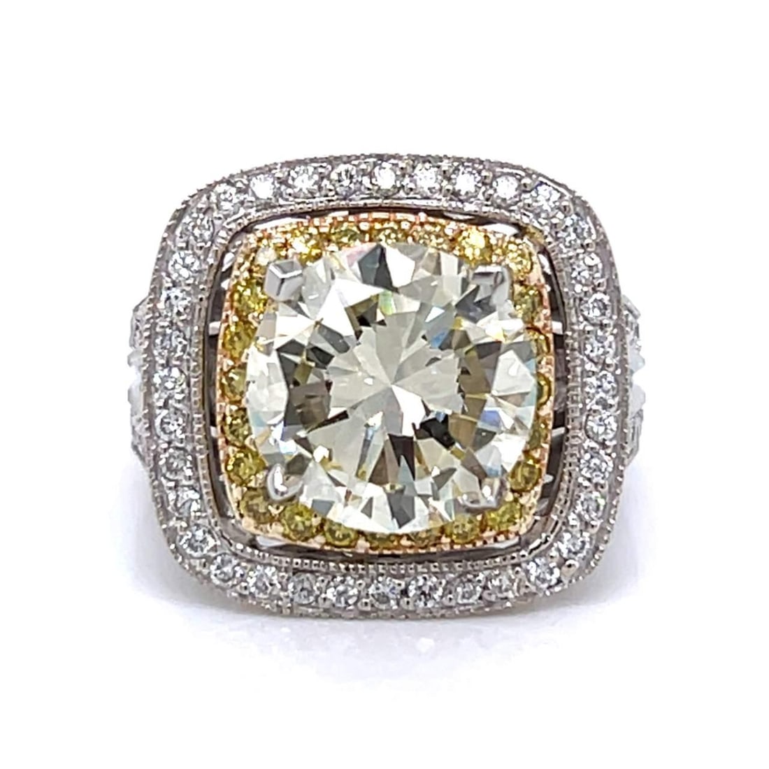 SONIA B. 14K Gold 5.39 Ct Fancy Light Yellow Diamond Ring: SONIA B. 14K Gold 5.39 Ct Fancy Light Yellow Diamond Ring This exquisite ring features a stunning combination of 14K white and yellow gold, showcasing a remarkable 5.39 ct. Fancy Light Yellow Diamond 