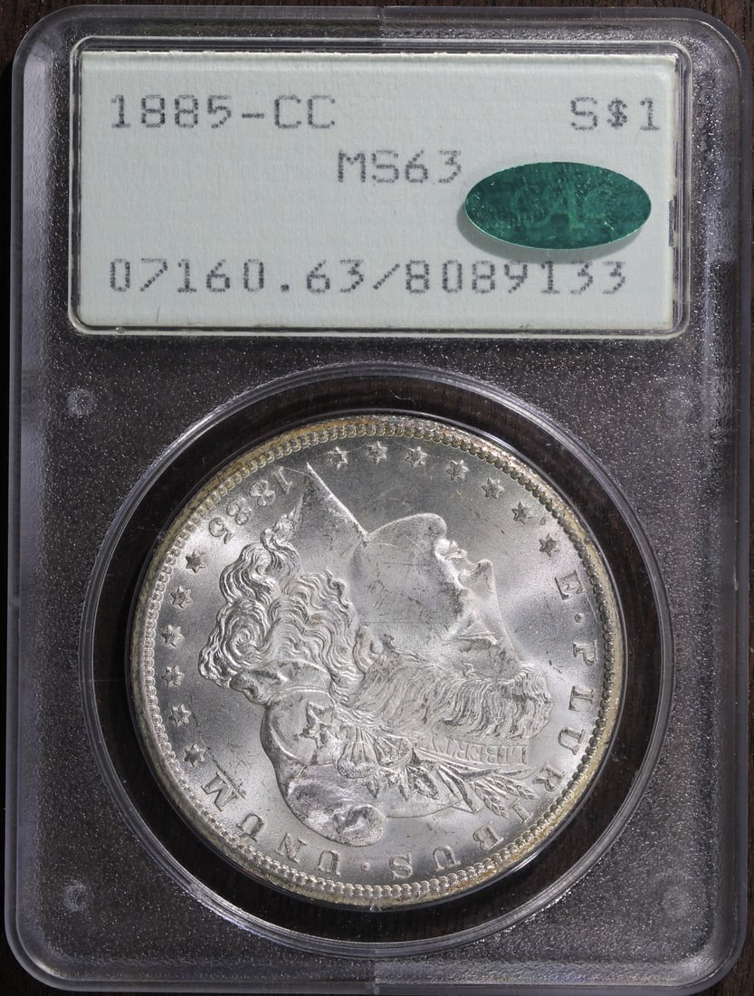 PCGS MS63 CAC 1885 Carson City Morgan Dollar in Rattler Holder: PCGS MS63 CAC 1885 Carson City Morgan Dollar in Rattler Holder This is an un-used 1885-CC Morgan Silver Dollar graded MS63 by PCGS with CAC approval. Minted in Carson City, this silver dollar features