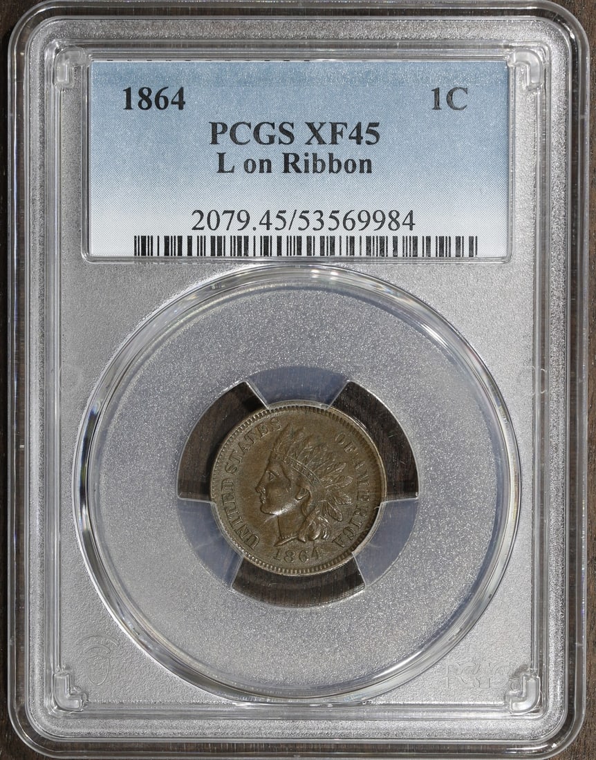 PCGS XF45 1864 Indian Head Cent L on Ribbon Copper Coin: PCGS XF45 1864 Indian Head Cent L on Ribbon Copper Coin This 1864 Indian Head Cent features the 'L on Ribbon' variety and has been graded XF45 by PCGS. Struck in copper at the Philadelphia Mint, this 