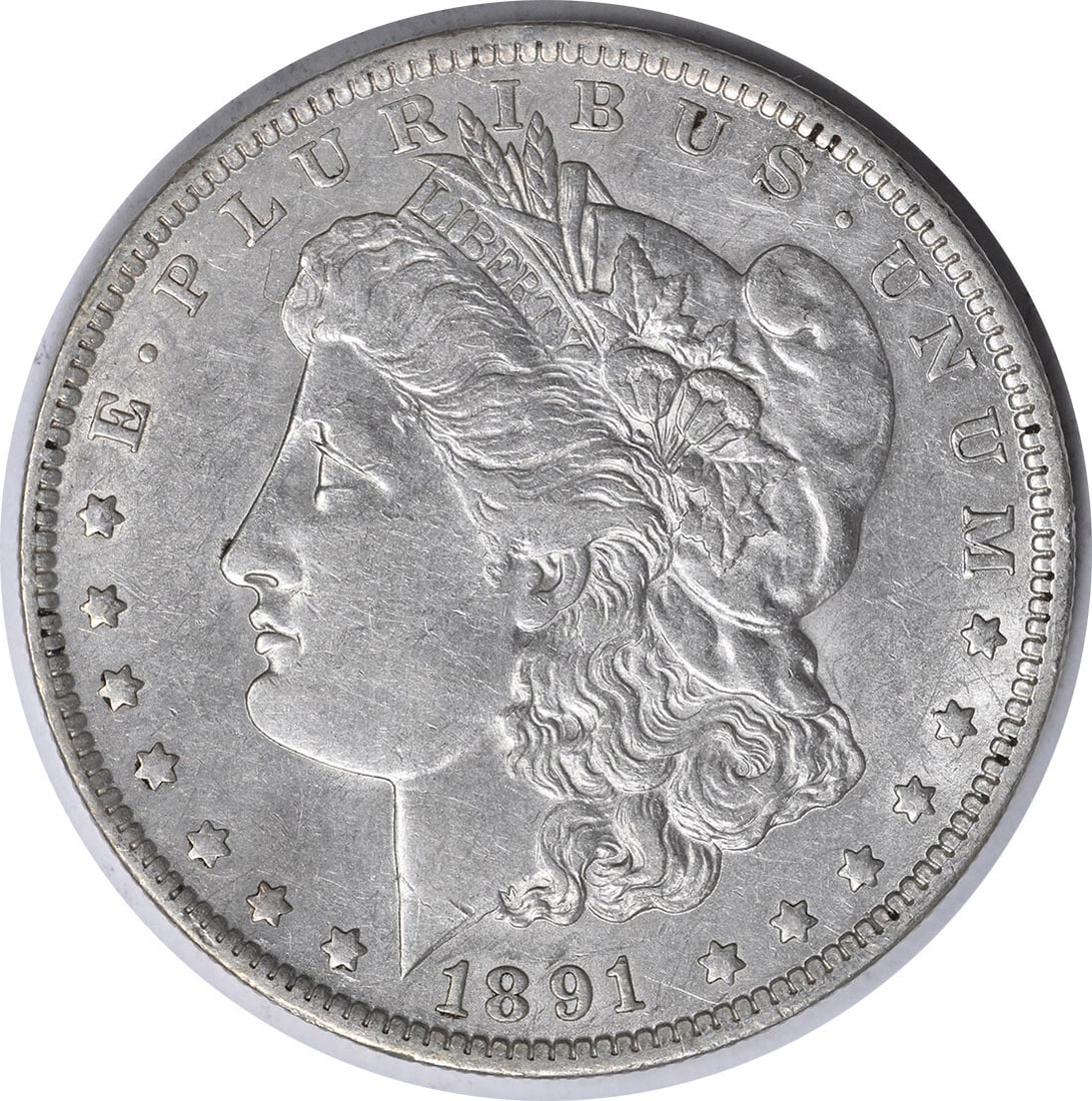 1891-O United States Morgan Dollar 90 Percent Silver XF Uncertified Coin: 1891-O United States Morgan Dollar 90 Percent Silver XF Uncertified Coin This 1891-O Morgan Silver Dollar is a circulated, pre-owned coin minted in New Orleans. Designed by George T. Morgan, it is com
