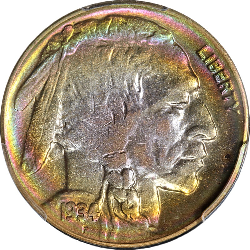 PCGS AU58 1934-D Buffalo Nickel With Vibrant Rainbow Toning: PCGS AU58 1934-D Buffalo Nickel With Vibrant Rainbow Toning This 1934-D Buffalo Nickel is graded AU58 by PCGS and features distinctive rainbow toning. Minted in Denver, this circulated coin is compose