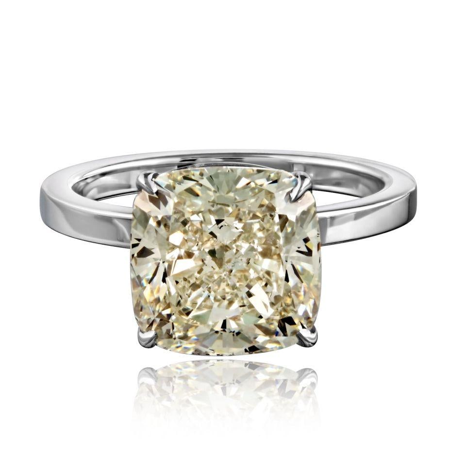 GIA Certified 5.01ct Cushion Diamond Solitaire in 14K White Gold: GIA Certified 5.01ct Cushion Diamond Solitaire in 14K White Gold This pre-owned solitaire engagement ring features a 5.01 carat cushion cut natural diamond set in a 14K white gold four-prong setting. 