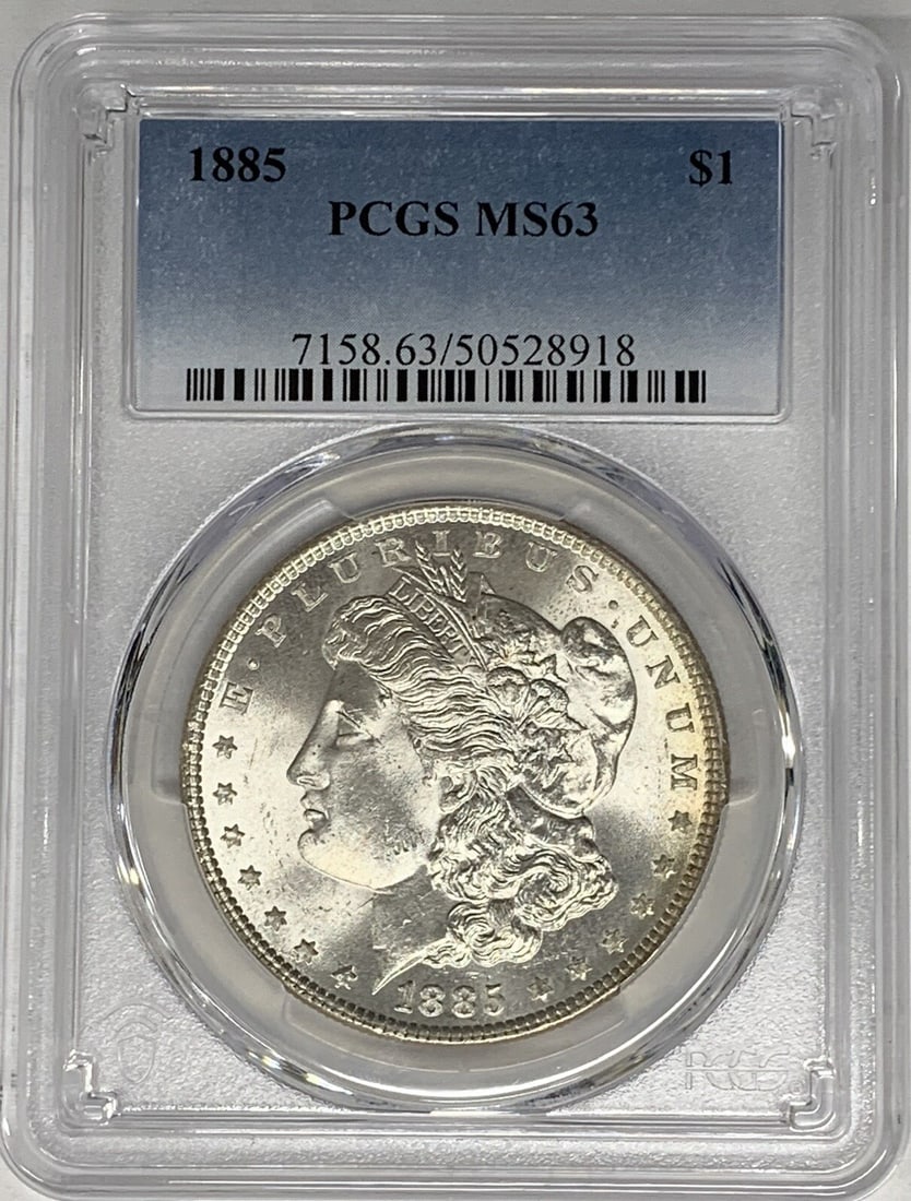 PCGS MS 63 Graded 1885 Morgan Dollar Silver Coin United States: PCGS MS 63 Graded 1885 Morgan Dollar Silver Coin United States This is an 1885 Morgan Silver Dollar from the United States, graded MS 63 by PCGS. The coin is uncirculated and composed of silver, with 