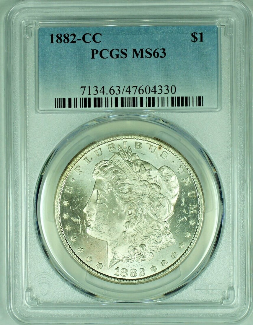 PCGS MS 63 1882-CC Morgan Dollar Silver Coin: PCGS MS 63 1882-CC Morgan Dollar Silver Coin This is an 1882-CC Morgan Silver Dollar from the United States, featuring a composition of silver. The coin is uncirculated and has been certified by PCGS 