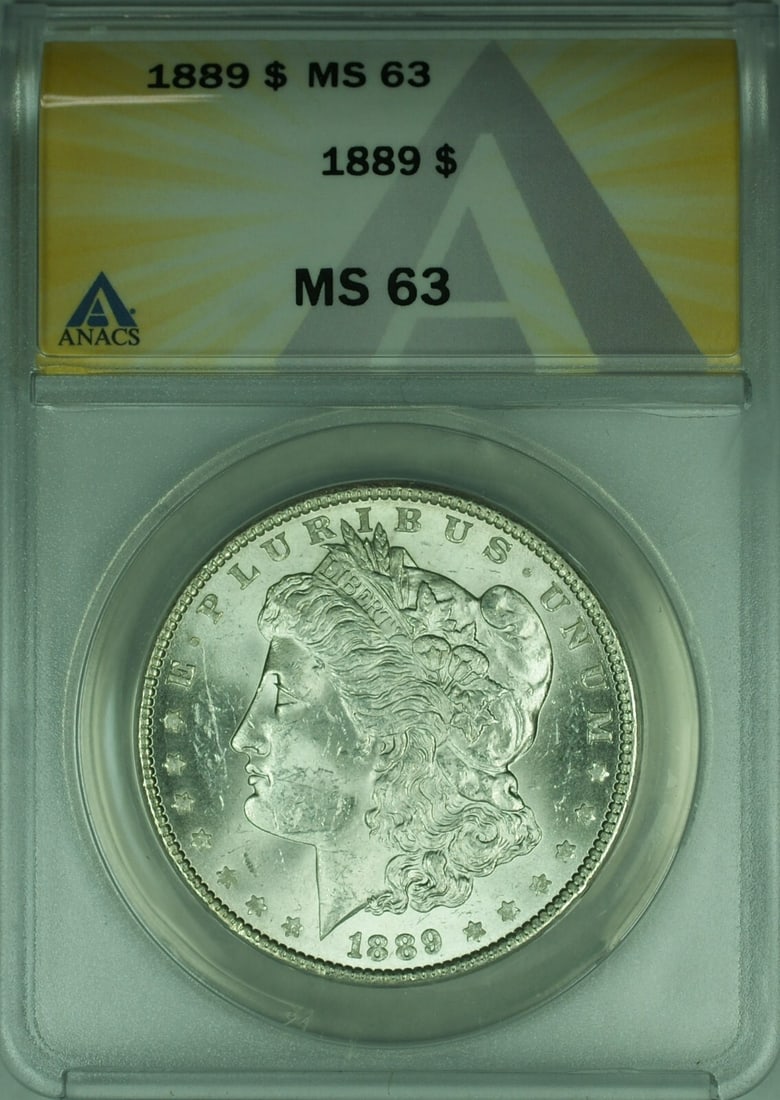 1889 Morgan Dollar ANACS MS 63 Graded Uncirculated Silver Coin: 1889 Morgan Dollar ANACS MS 63 Graded Uncirculated Silver Coin This 1889 Morgan Silver Dollar is an uncirculated coin graded MS-63 by ANACS. Minted in Philadelphia, it is composed of 90% silver and re
