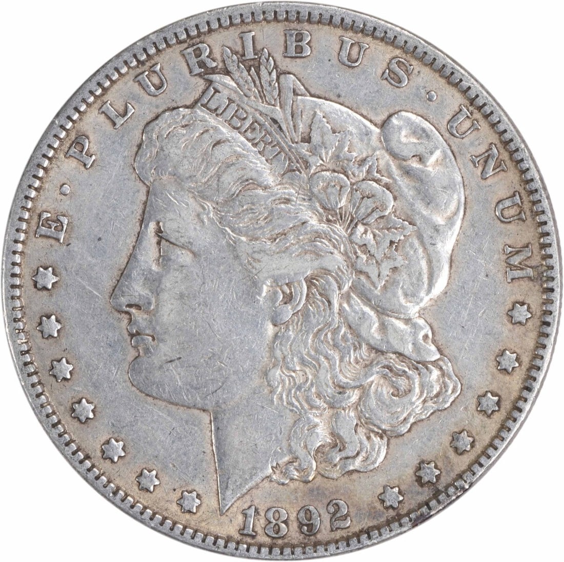 1892 Morgan Silver Dollar Uncertified 90% Silver XF Coin: 1892 Morgan Silver Dollar Uncertified 90% Silver XF Coin This 1892 Morgan Silver Dollar is a remarkable piece of American numismatic history, featuring a striking design by George T. Morgan. The coin 