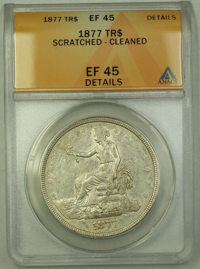 1877 Silver Trade Dollar ANACS XF 45 Certified US $1 Coin: 1877 Silver Trade Dollar ANACS XF 45 Certified US $1 Coin This is an 1877 United States Trade Dollar silver coin with a denomination of $1. Graded XF 45 by ANACS, the coin is circulated and has been n