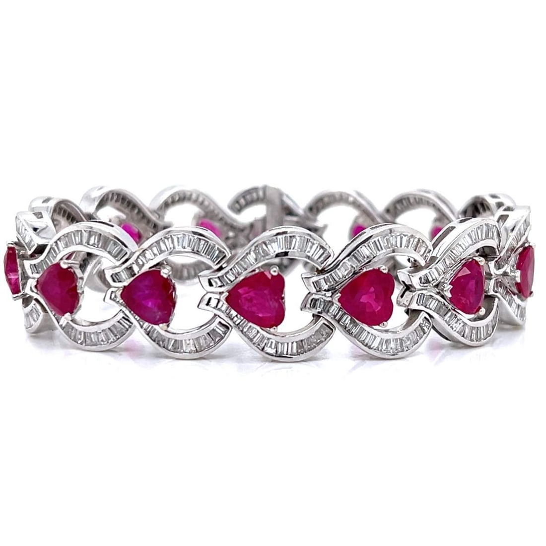 18K White Gold Ruby Diamond Bracelet GIA Certified 20.00 Ct: 18K White Gold Ruby Diamond Bracelet GIA Certified 20.00 Ct This exquisite 18K white gold bracelet features a stunning combination of rubies and diamonds. Weighing 39.6 grams, it is set with 14 purpli