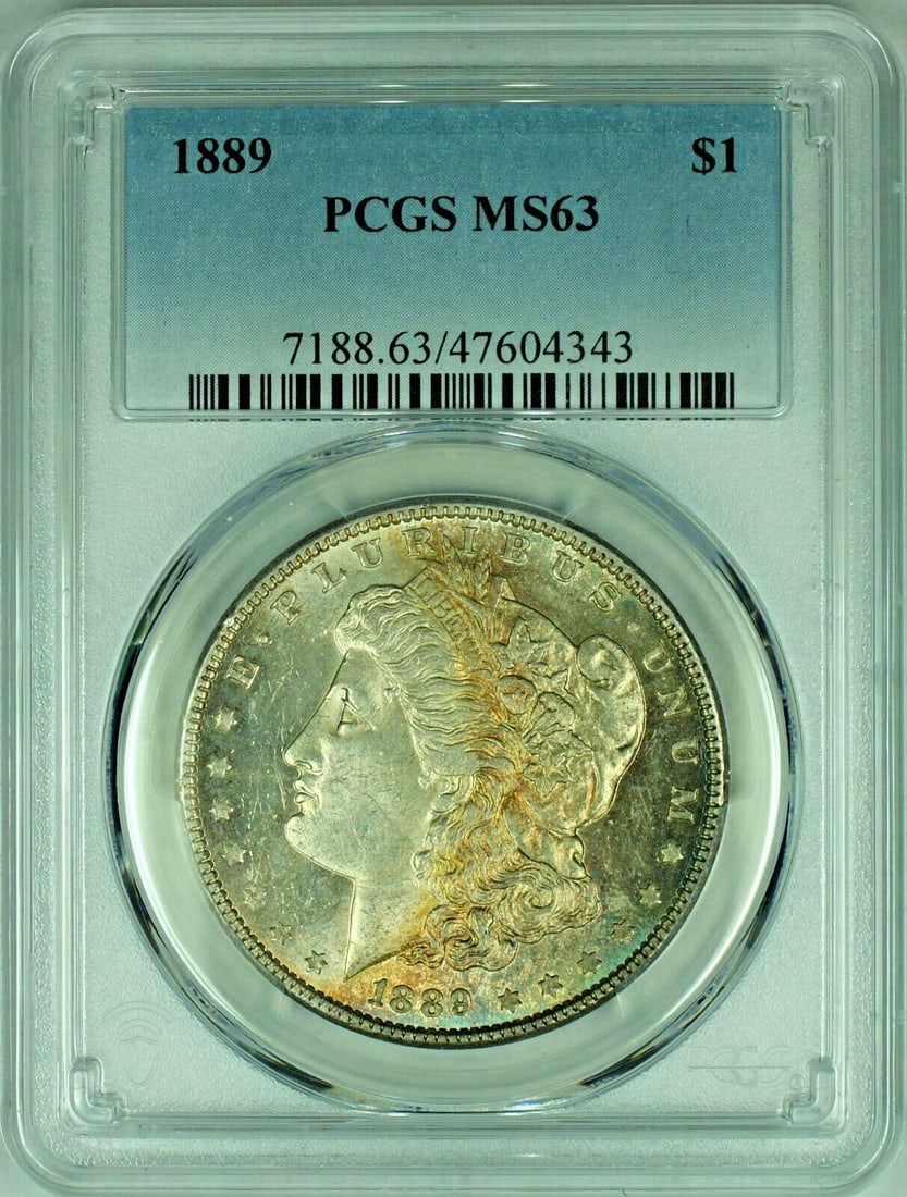PCGS MS 63 1889 Morgan Silver Dollar With Attractive Toning: PCGS MS 63 1889 Morgan Silver Dollar With Attractive Toning This 1889 Morgan Silver Dollar features attractive toning and is graded MS 63 by PCGS. It is composed of silver and remains in uncirculated 