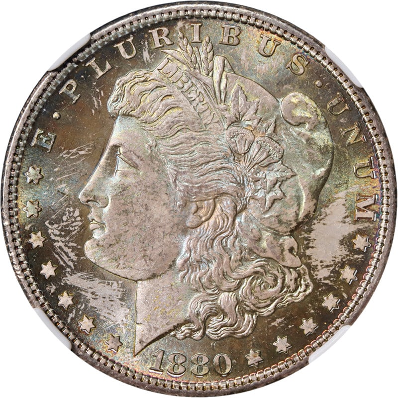 NGC MS66 CAC 1880-S Morgan Dollar With Attractive Toning: NGC MS66 CAC 1880-S Morgan Dollar With Attractive Toning This 1880-S Morgan Silver Dollar is certified by NGC with a grade of MS66 and features a CAC sticker, indicating its quality. The coin displays