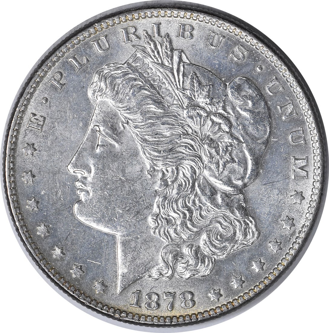 1878 Morgan Dollar 7 Tail Feathers Reverse Philadelphia AU Uncertified US Coin: 1878 Morgan Dollar 7 Tail Feathers Reverse Philadelphia AU Uncertified US Coin This is an 1878 Morgan Silver Dollar featuring the 7 Tail Feathers Reverse of 1878 design. Minted in Philadelphia, this c