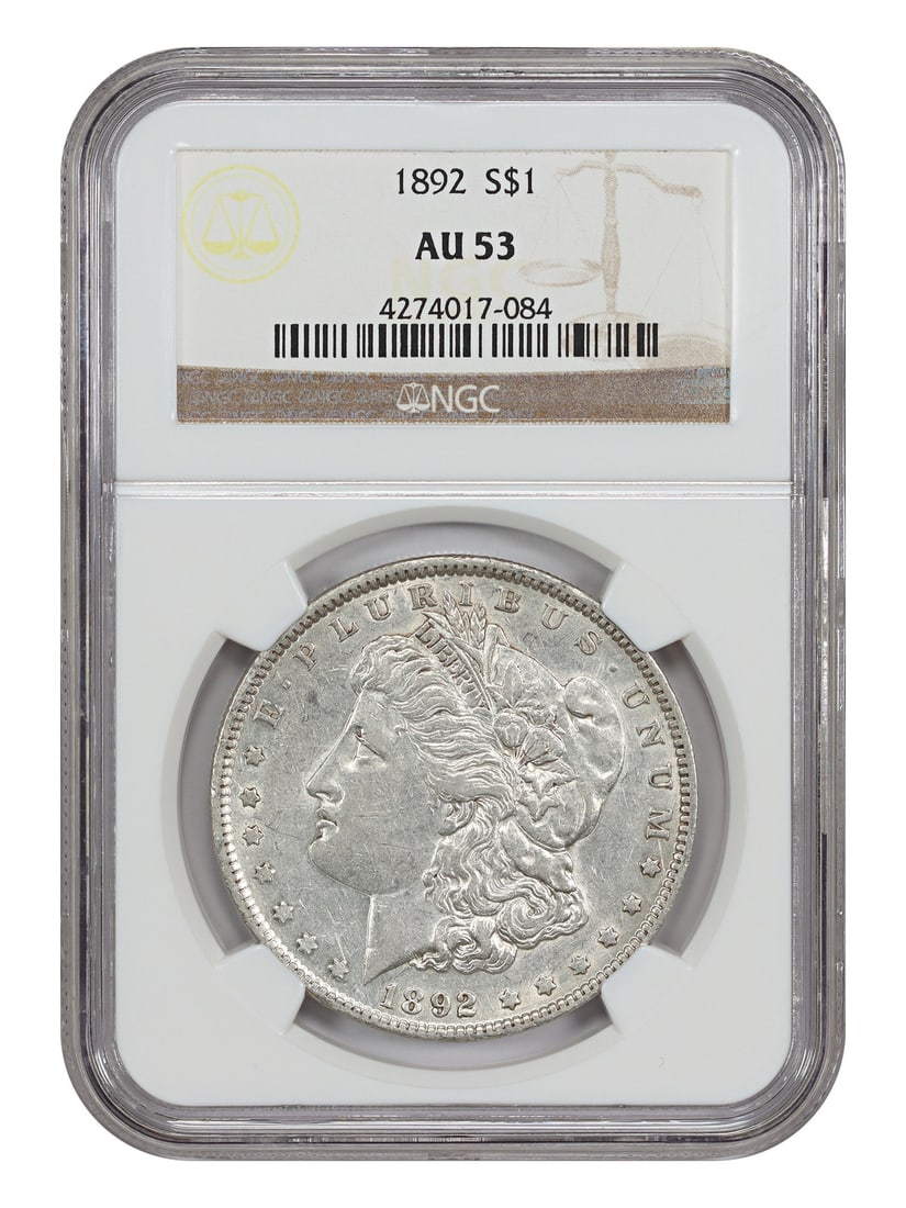 NGC AU53 1892 Morgan Silver Dollar Philadelphia Mint: NGC AU53 1892 Morgan Silver Dollar Philadelphia Mint This is an 1892 Morgan Dollar graded AU53 by NGC. Minted in Philadelphia, this circulated $1 coin is part of the Morgan Dollar series and is consid