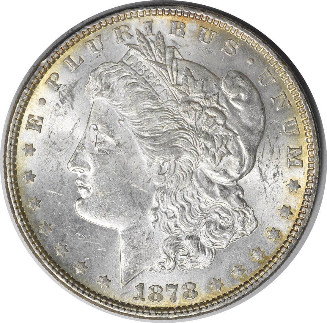 1878 Silver Morgan Dollar 7 Tail Feathers Reverse Brilliant Uncirculated Uncertified: 1878 Silver Morgan Dollar 7 Tail Feathers Reverse Brilliant Uncirculated Uncertified This is an 1878 Morgan Silver Dollar featuring the 7 Tail Feathers Reverse of 1878. The coin is uncirculated and in
