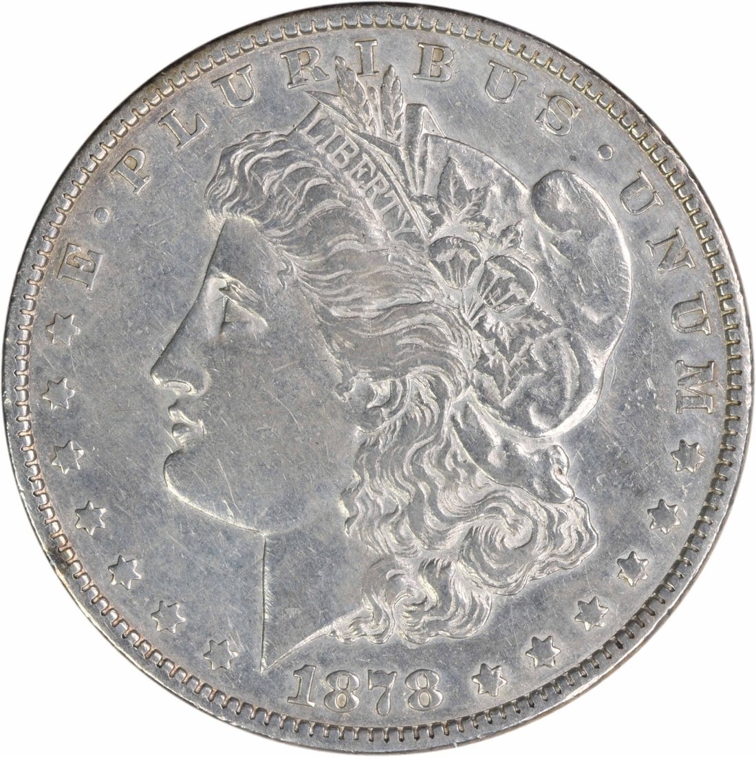 1878 Morgan Dollar 7 Over 8 Tailfeathers EF Grade Philadelphia Uncertified: 1878 Morgan Dollar 7 Over 8 Tailfeathers EF Grade Philadelphia Uncertified This is a 1878 Morgan Silver Dollar featuring the 7/8 Tail Feathers (Weak) variety. Struck at the Philadelphia Mint, this cir