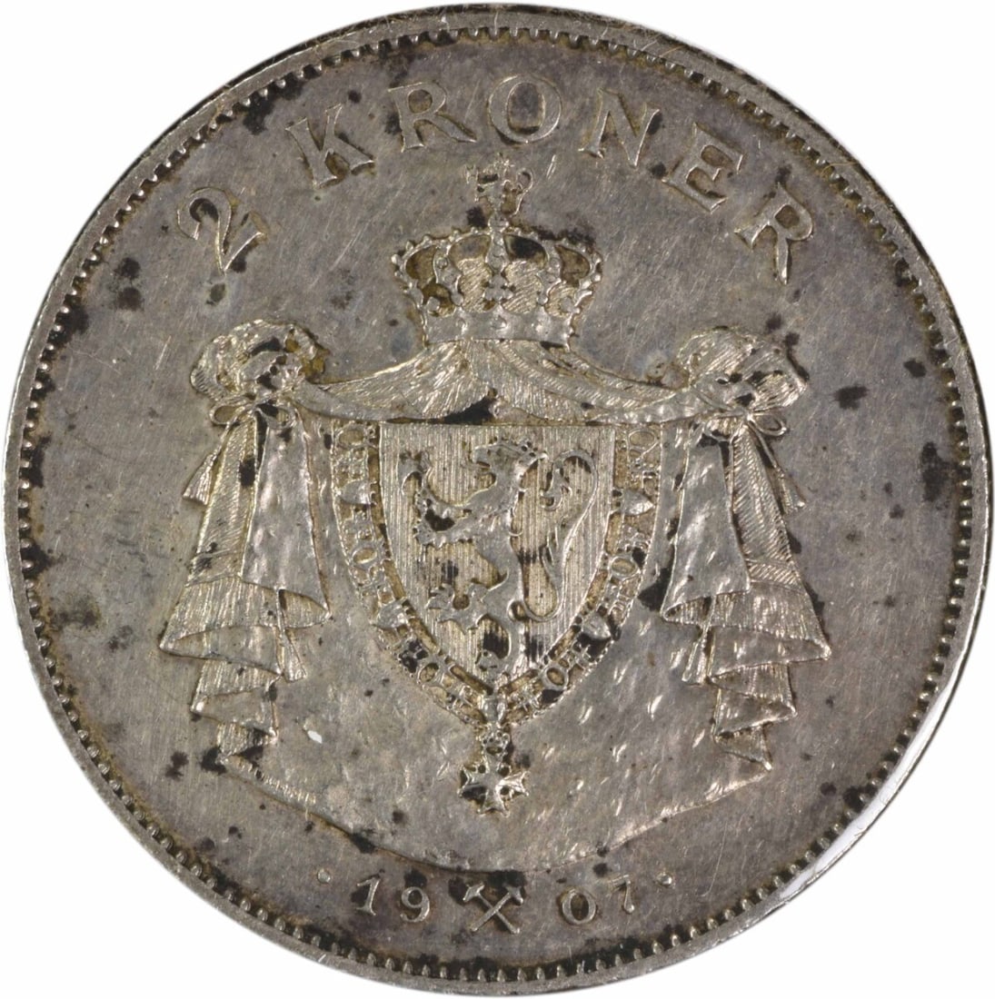 1907 Norway 2 Kroner AU Grade Uncertified Coin KM366: 1907 Norway 2 Kroner AU Grade Uncertified Coin KM366 This 1907 Norway 2 Kroner coin is an attractive collectible from Norway. It is circulated and graded AU (About Uncirculated), offering a well-prese