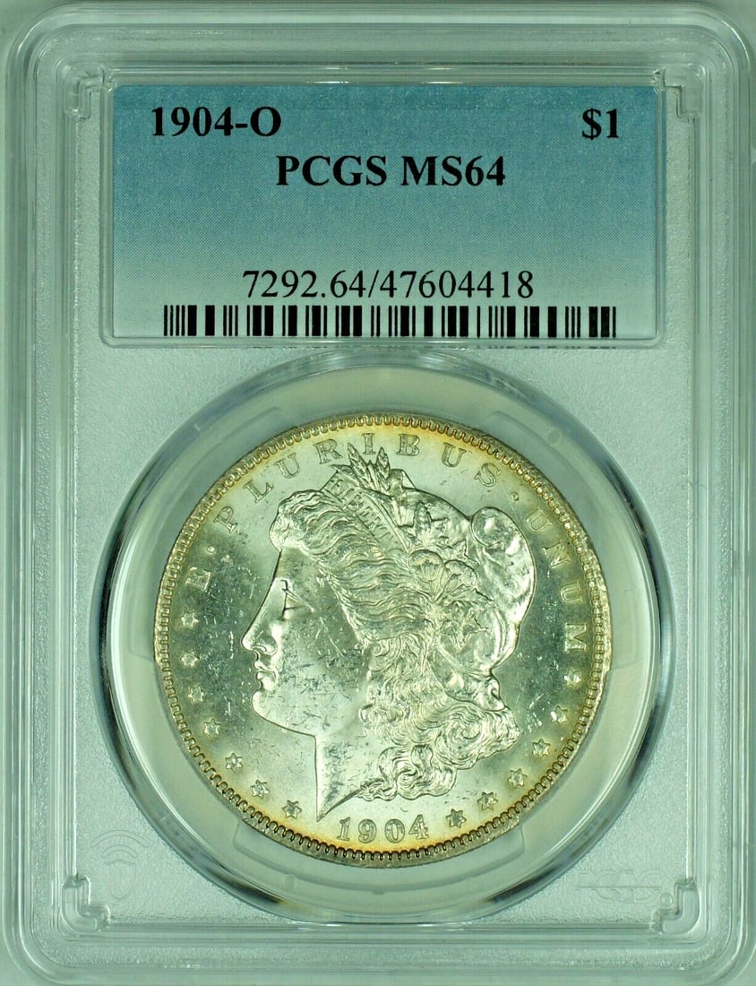 PCGS MS64 1904-O Morgan Silver Dollar with Toned Reverse: PCGS MS64 1904-O Morgan Silver Dollar with Toned Reverse This 1904-O Morgan Silver Dollar features a toned reverse and has been graded MS 64 by PCGS. The coin is uncirculated and composed of silver, r