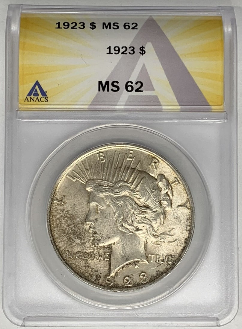 1923 Peace Dollar Silver Coin ANACS Certified MS 62 Grade: 1923 Peace Dollar Silver Coin ANACS Certified MS 62 Grade This is a 1923 Peace Silver Dollar graded MS 62 by ANACS. The coin is uncirculated and composed of silver, representing the United States Peac
