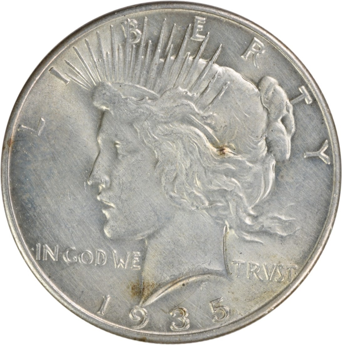 1935 Peace Silver Dollar AU Uncertified 90% Silver Coin: 1935 Peace Silver Dollar AU Uncertified 90% Silver Coin This 1935 Peace Silver Dollar features an attractive AU grade and is part of a limited mintage of 1,576,000 coins. Crafted with 90% silver and 1