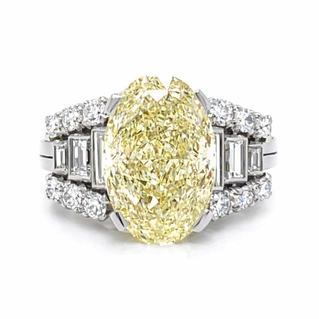 GIA 5.03 Ct Oval Diamond Ring in Platinum and 18K White Gold: GIA 5.03 Ct Oval Diamond Ring in Platinum and 18K White Gold This elegant ring features a GIA certified 5.03 carat oval diamond with Y-Z color and VS2 clarity, set in a combination of platinum and 18K