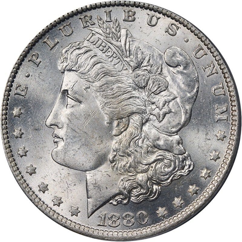 PCGS MS64 1880-O Silver Morgan Dollar New Orleans Mint Blast White: PCGS MS64 1880-O Silver Morgan Dollar New Orleans Mint Blast White This stunning 1880-O Morgan Silver Dollar, certified by PCGS as MS64, showcases exceptional eye appeal with its blast white finish an