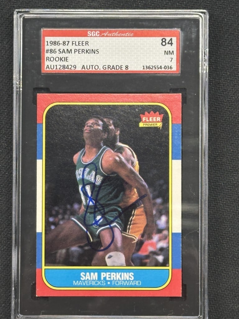 Sam Perkins 1986 Fleer Signed SGC 7 Mavericks Rookie Card: Sam Perkins 1986 Fleer Signed SGC 7 Mavericks Rookie Card This 1986 Fleer basketball card features a hand-signed autograph from Sam Perkins, a notable player for the Dallas Mavericks. The card is grad