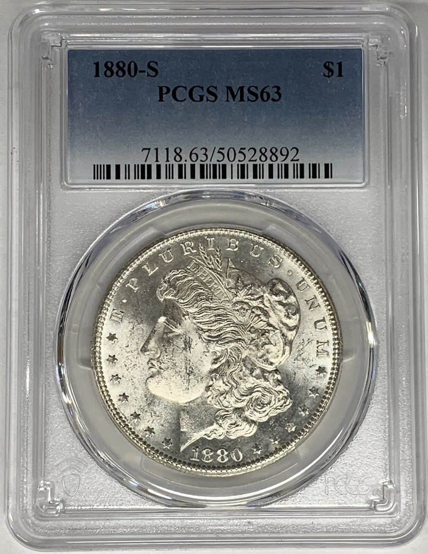 PCGS MS 63 Graded 1880-S Morgan Dollar Uncirculated Silver Coin: PCGS MS 63 Graded 1880-S Morgan Dollar Uncirculated Silver Coin This is an 1880-S Morgan Silver Dollar graded MS 63 by PCGS. The coin is uncirculated and composed of silver, with a denomination of $1.