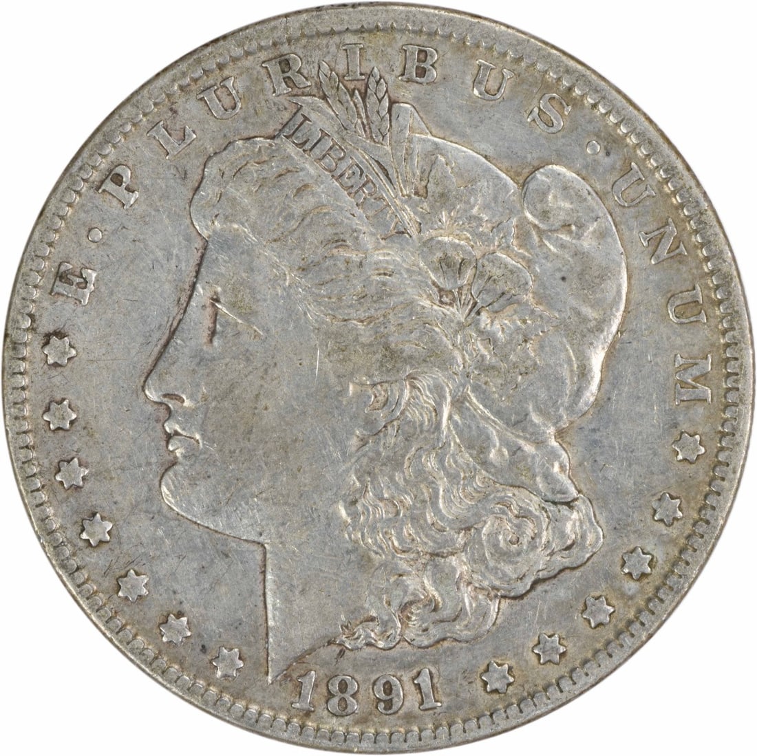 1891-CC Morgan Silver Dollar Uncertified 90% Silver Coin: 1891-CC Morgan Silver Dollar Uncertified 90% Silver Coin This 1891-CC Morgan Silver Dollar is a captivating piece of numismatic history, featuring a striking design by George T. Morgan. The coin is co