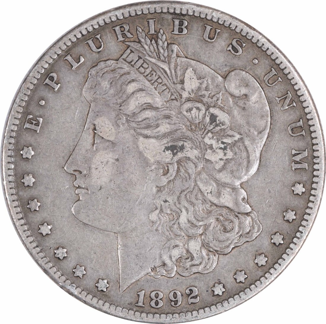 1892-S Morgan Silver Dollar VF Uncertified San Francisco Coin: 1892-S Morgan Silver Dollar VF Uncertified San Francisco Coin This 1892-S Morgan Silver Dollar is a captivating piece of American coinage, featuring a composition of 90% silver and 10% copper. It was 